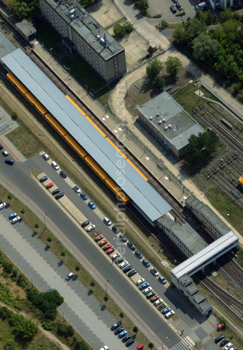 Berlin from above - Building complex and rail tracks of the U-Bahn station Hoenow in the Hellersdorf part of Berlin in Germany. The station is the Eastern most station of the U5 line of the Berlin underground system. It consists of the actual station, several outbuildings and parking lots as well as the large holding track facilities