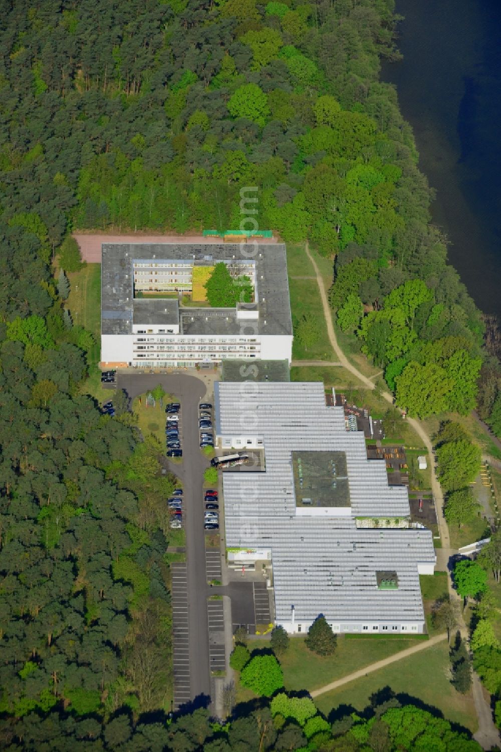 Berlin from the bird's eye view: Complex of the hotel building Hotel Mueggelsee in Berlin in Germany. The hotel is located on the shores of the lake in the nature protection area of Koepenick and consists of a square building and a park