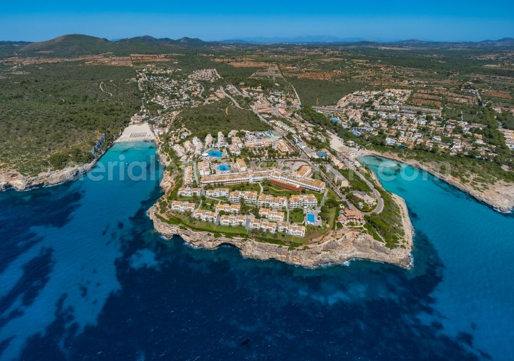 Cala Anguila-Cala Mendia from above - Complex of the hotel building of Blau Punta Reina Family Resort auf of Halbinsel Punta de Ses Ovelles on Placa de s'Algar along the Carrer de la Punta Reina in Cala Anguila-Cala Mendia in Balearic island of Mallorca, Spain