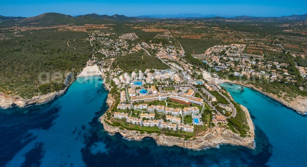 Cala Anguila-Cala Mendia from the bird's eye view: Complex of the hotel building of Blau Punta Reina Family Resort auf of Halbinsel Punta de Ses Ovelles on Placa de s'Algar along the Carrer de la Punta Reina in Cala Anguila-Cala Mendia in Balearic island of Mallorca, Spain