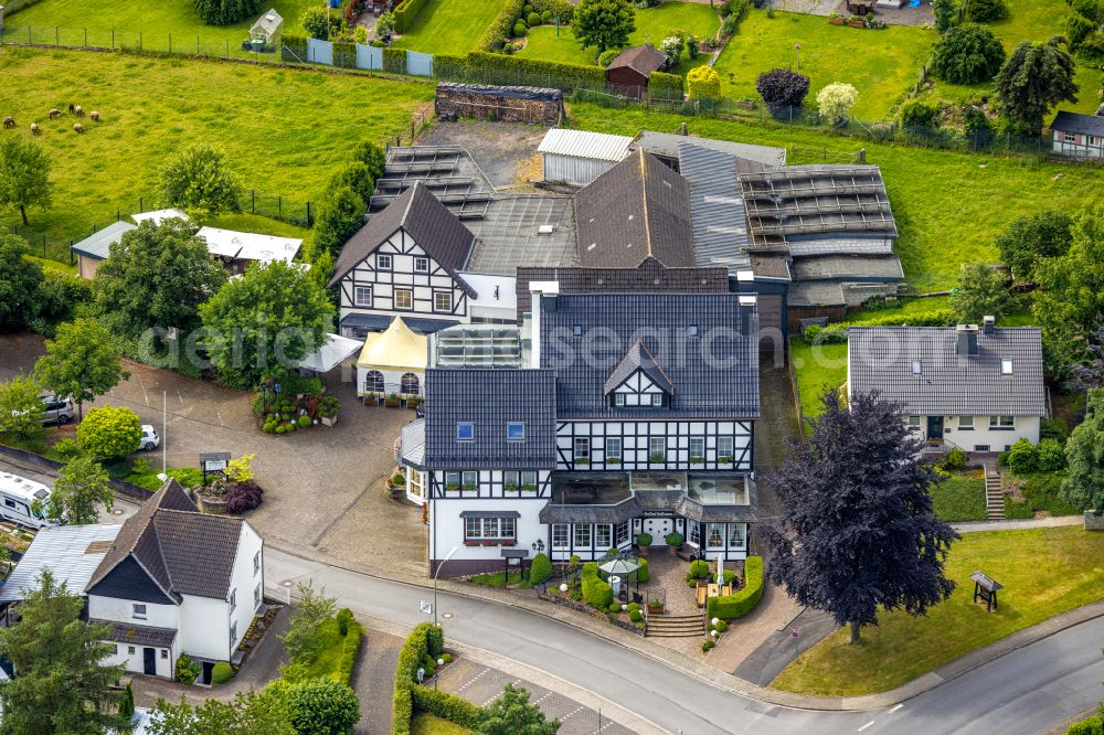 Arnsberg from the bird's eye view: Complex of the hotel building and the restaurant Gasthof Hoffmann in the Mescheder street in the district Rumbeck in Arnsberg at Sauerland in the state North Rhine-Westphalia