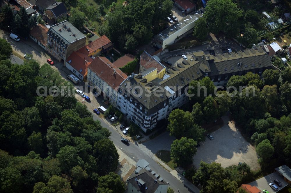 Hoppegarten from the bird's eye view: Complex of the hotel building Hotel Mardin in Hoppegarten in the state Brandenburg. The building is currently used as an accommodation center for refugees and asylum seekers in voucher basis