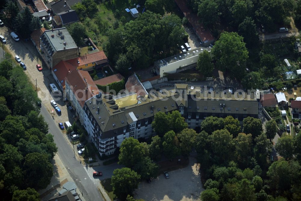 Aerial image Hoppegarten - Complex of the hotel building Hotel Mardin in Hoppegarten in the state Brandenburg. The building is currently used as an accommodation center for refugees and asylum seekers in voucher basis