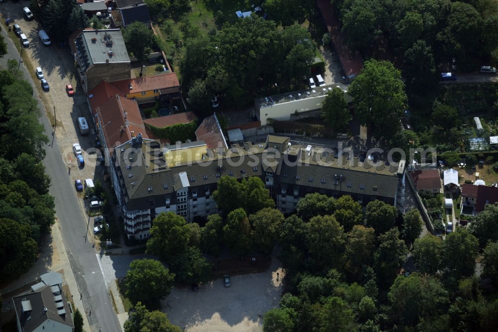 Hoppegarten from the bird's eye view: Complex of the hotel building Hotel Mardin in Hoppegarten in the state Brandenburg. The building is currently used as an accommodation center for refugees and asylum seekers in voucher basis