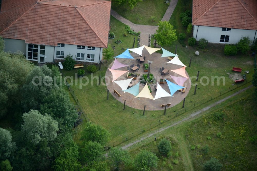 Aerial image Templin - With colorful pennants - chain decorated outdoor terrace on complex of the hotel building Landsitz-Hotel in Templin in the state Brandenburg