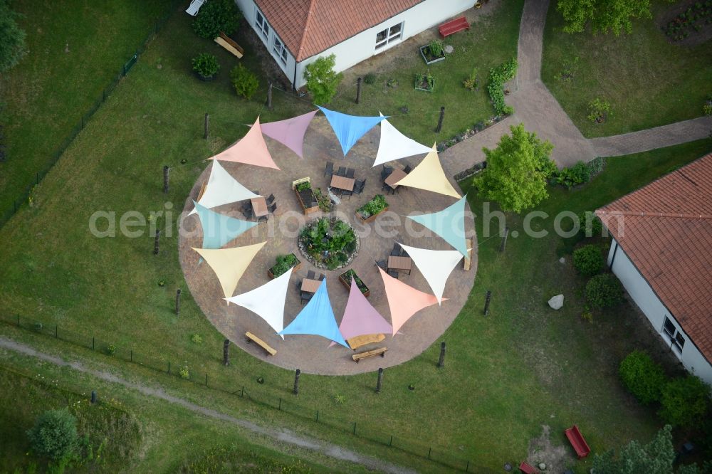 Aerial image Templin - With colorful pennants - chain decorated outdoor terrace on complex of the hotel building Landsitz-Hotel in Templin in the state Brandenburg