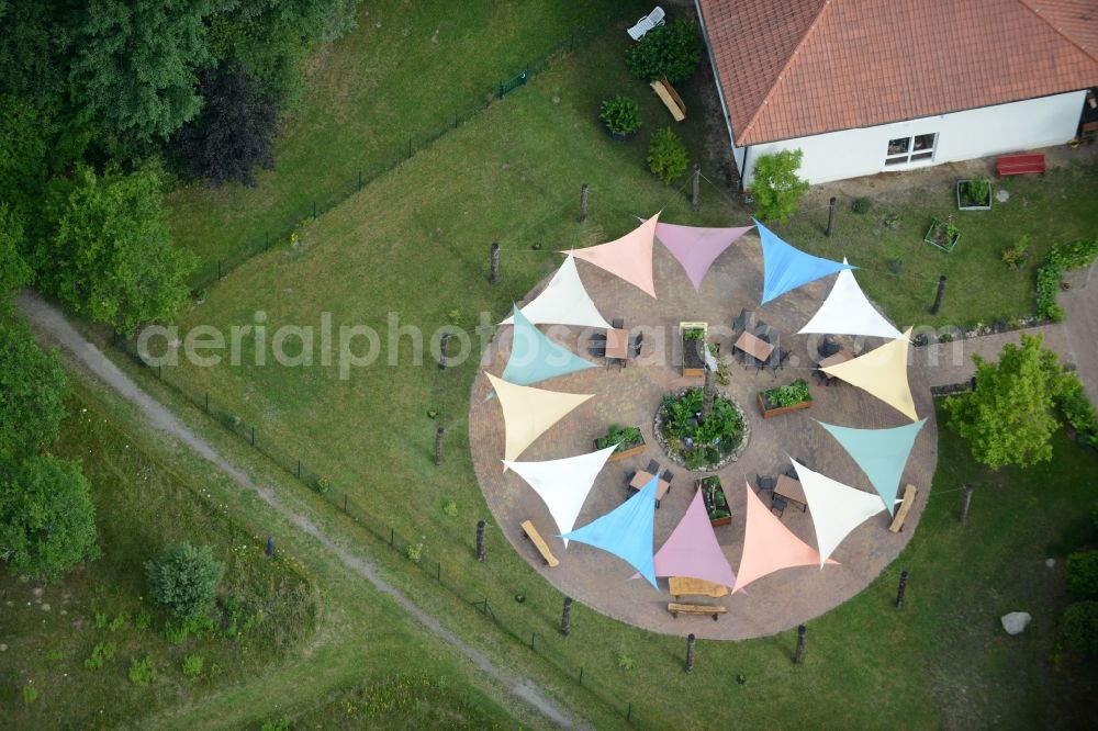 Aerial photograph Templin - With colorful pennants - chain decorated outdoor terrace on complex of the hotel building Landsitz-Hotel in Templin in the state Brandenburg