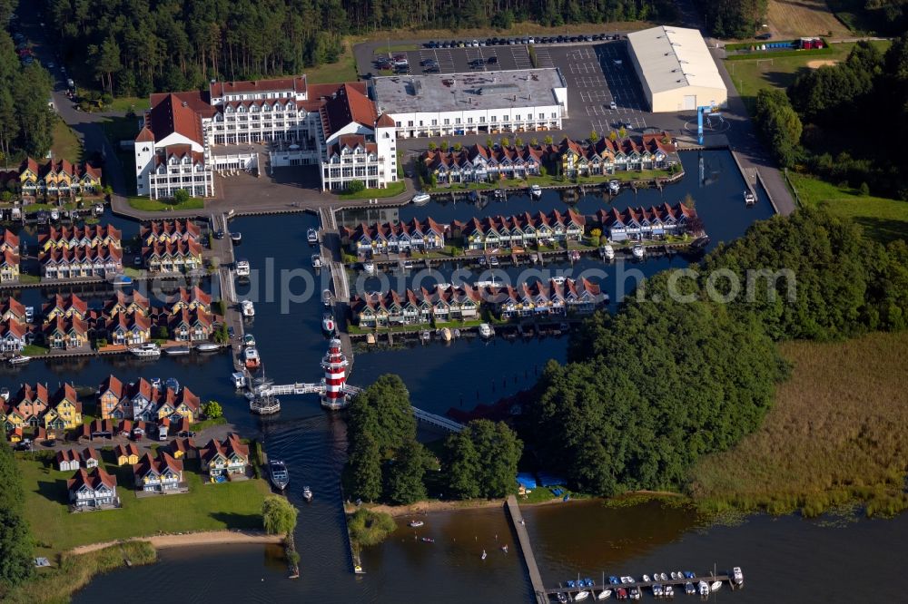 Rheinsberg from the bird's eye view: Building complex of the hotel complex Maritim Hafenhotel Rheinsberg in Rheinsberg on the bank of the Rheinsberg lake in the state of Brandenburg, Germany