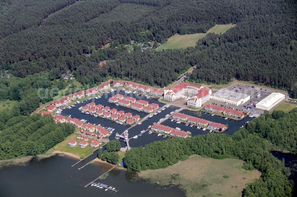 Rheinsberg from the bird's eye view: Building complex of the hotel complex Maritim Hafenhotel Rheinsberg in Rheinsberg on the bank of the Rheinsberg lake in the state of Brandenburg, Germany