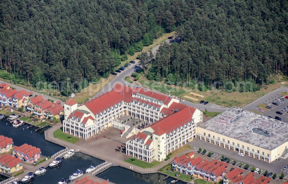 Aerial image Rheinsberg - Building complex of the hotel complex Maritim Hafenhotel Rheinsberg in Rheinsberg on the bank of the Rheinsberg lake in the state of Brandenburg, Germany