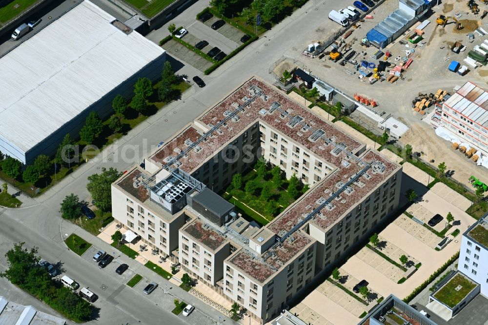 Aschheim from above - Complex of the hotel building MASEVEN Muenchen Messe Dornach on Bahnhofstrasse in the district Dornach in Aschheim in the state Bavaria, Germany