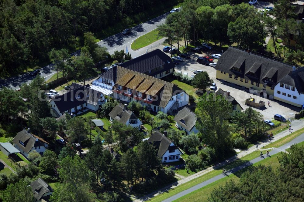 Wustrow from the bird's eye view: Complex of the hotel building Ostseehotel Wustrow in the South of Wustrow in the state of Mecklenburg - Western Pomerania. The compound of the beach hotel is surrounded by trees and forest and is located on bicycle road