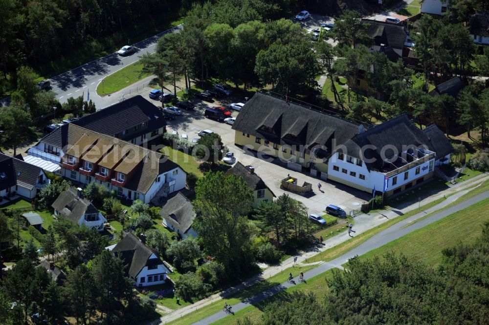 Aerial image Wustrow - Complex of the hotel building Ostseehotel Wustrow in the South of Wustrow in the state of Mecklenburg - Western Pomerania. The compound of the beach hotel is surrounded by trees and forest and is located on bicycle road