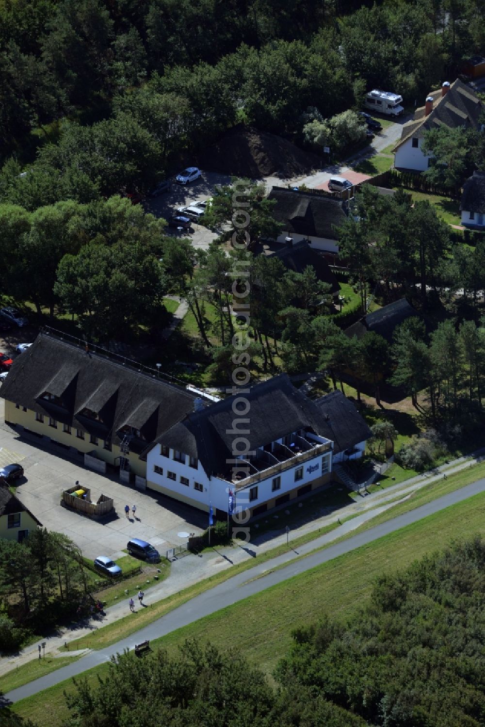 Aerial image Wustrow - Complex of the hotel building Ostseehotel Wustrow in the South of Wustrow in the state of Mecklenburg - Western Pomerania. The compound of the beach hotel is surrounded by trees and forest and is located on bicycle road