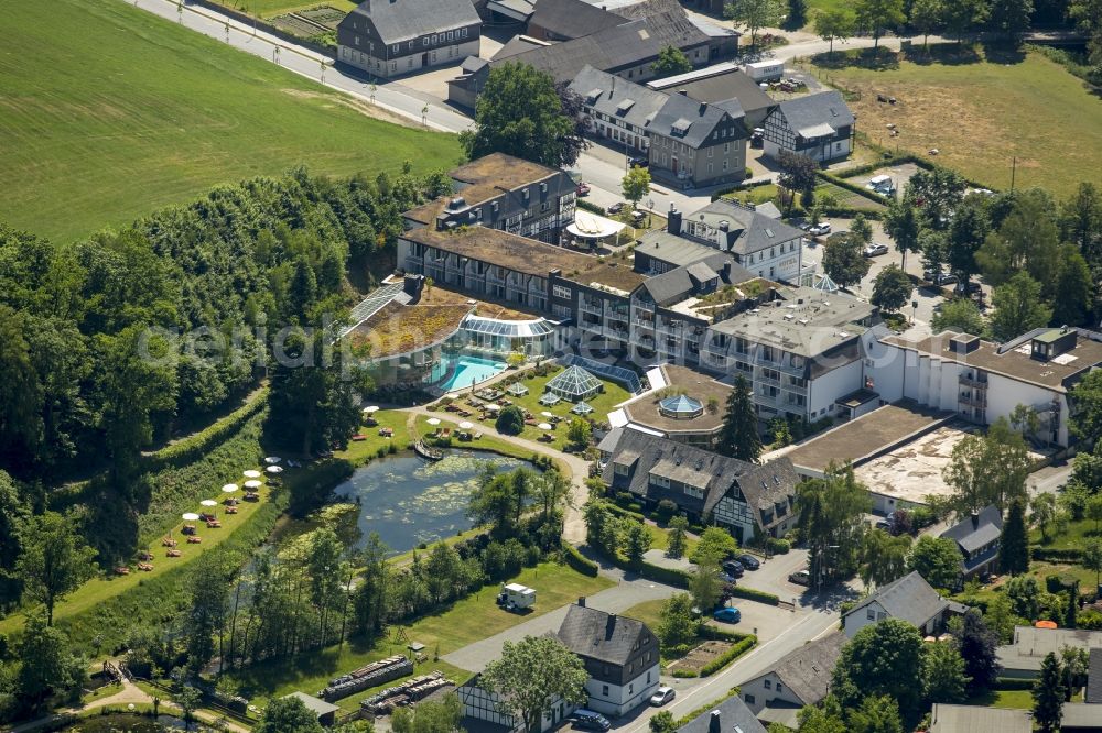 Schmallenberg from the bird's eye view: Complex of the hotel building Romantik- und Welnesshotel Deimann in Schmallenberg in the state North Rhine-Westphalia