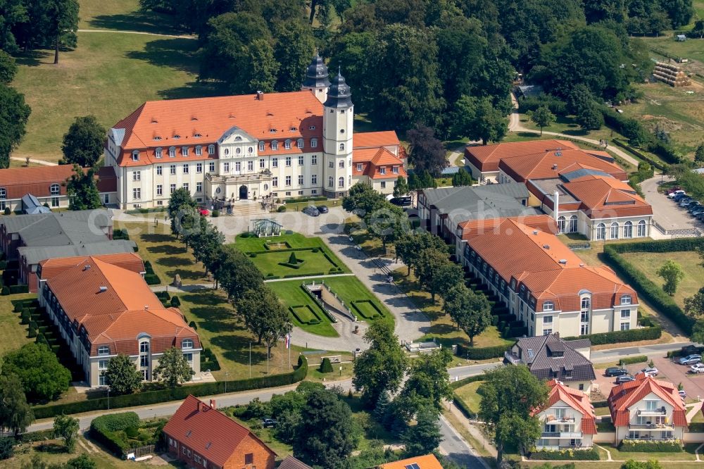 Göhren-Lebbin from the bird's eye view: Complex of the hotel building Schlosshotel Fleesensee in Goehren-Lebbin in the state Mecklenburg - Western Pomerania