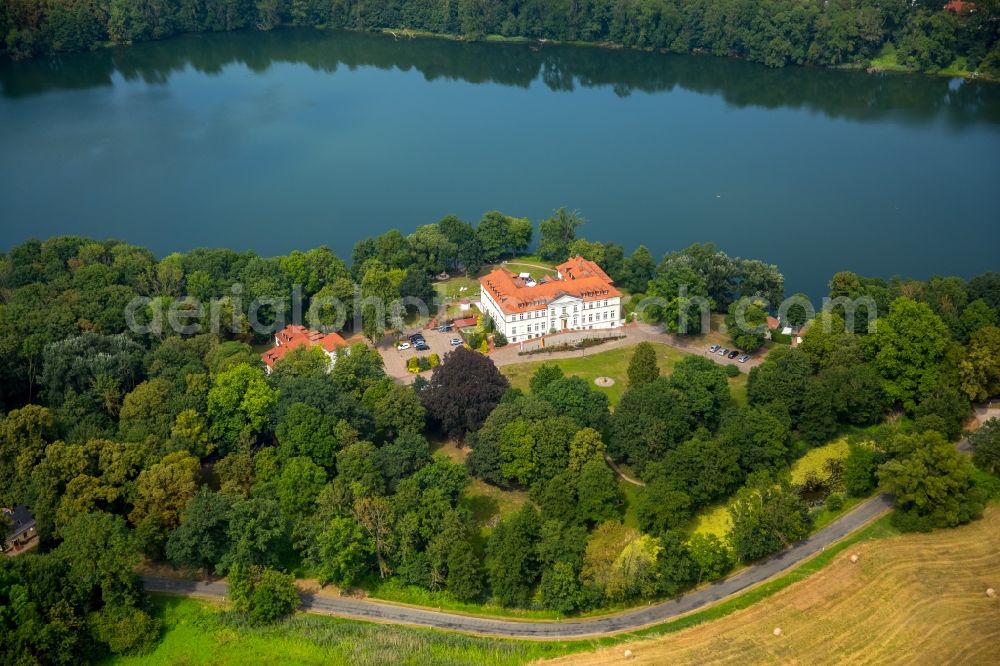 Schorssow from the bird's eye view: Complex of the hotel building Seeschloss Schorssow at Haussee in Schorssow in the state Mecklenburg - Western Pomerania