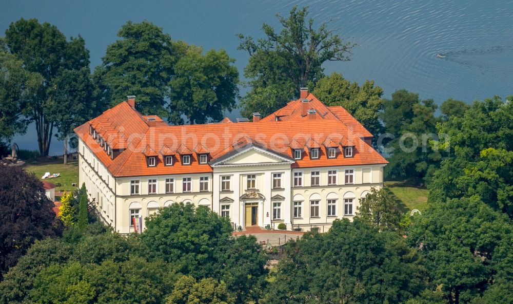 Schorssow from the bird's eye view: Complex of the hotel building Seeschloss Schorssow at Haussee in Schorssow in the state Mecklenburg - Western Pomerania