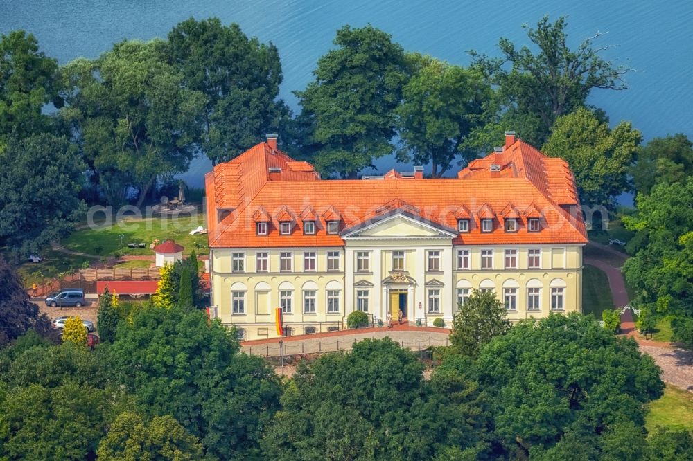 Schorssow from the bird's eye view: Complex of the hotel building Seeschloss Schorssow at Haussee in Schorssow in the state Mecklenburg - Western Pomerania