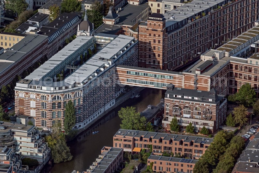 Leipzig from the bird's eye view: Complex of the hotel building TRINOM Business Apartments, Elster Lofts in the office and commercial building district along the course of the Weisse Elster river on Nonnenstrasse in the district Plagwitz in Leipzig in the state Saxony