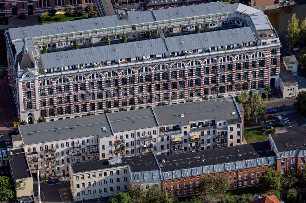 Leipzig from the bird's eye view: Complex of the hotel building TRINOM Business Apartments, Elster Lofts in the office and commercial building district along the course of the Weisse Elster river on Nonnenstrasse in the district Plagwitz in Leipzig in the state Saxony