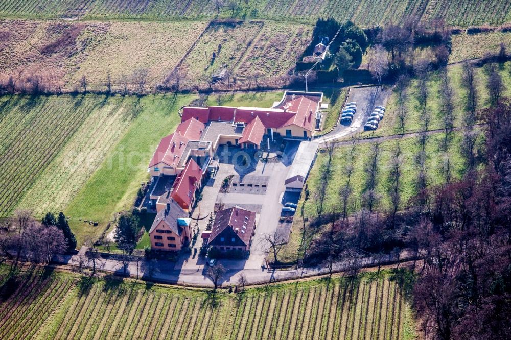 Rhodt unter Rietburg from the bird's eye view: Complex of the hotel building Wohlfuehlhotel Alte Rebschule and Gasthaus Sesel in Rhodt unter Rietburg in the state Rhineland-Palatinate, Germany