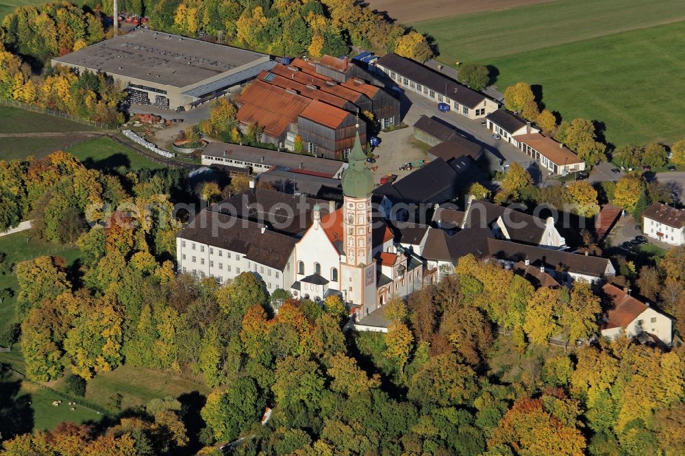 Andechs from above - Building complex of the monastery Andechs Klostergasthof in the state Bavaria. The pilgrimage to the holy mountain is the oldest pilgrimage in Bavaria and one of the most important pilgrimage sites in Bavaria. The Klosterschaenke Monastery Brewery with the beer garden on the terrace Braeustueberl maintains the tradition of pilgrimage restaurant