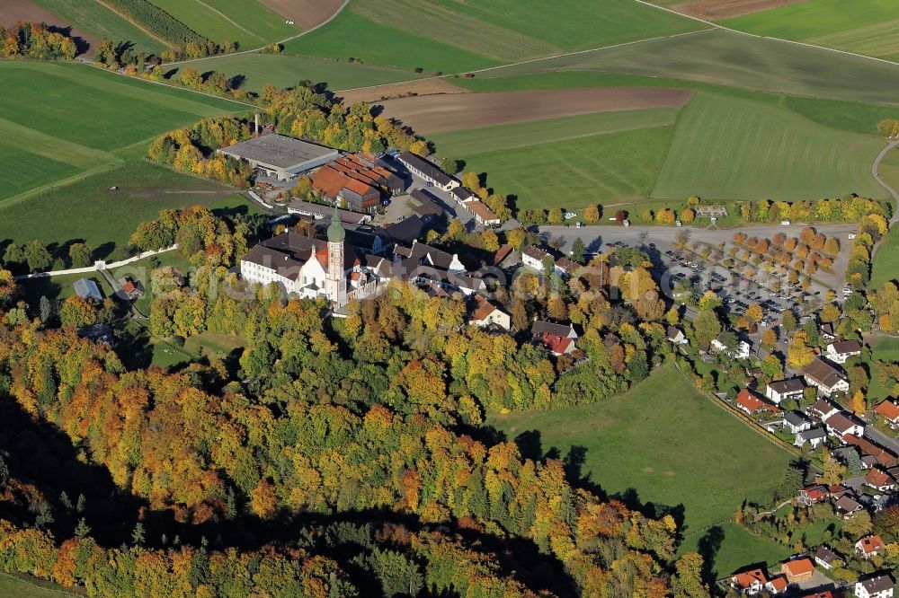 Andechs from the bird's eye view: Building complex of the monastery Andechs Klostergasthof in the state Bavaria. The pilgrimage to the holy mountain is the oldest pilgrimage in Bavaria and one of the most important pilgrimage sites in Bavaria. The Klosterschaenke Monastery Brewery with the beer garden on the terrace Braeustueberl maintains the tradition of pilgrimage restaurant