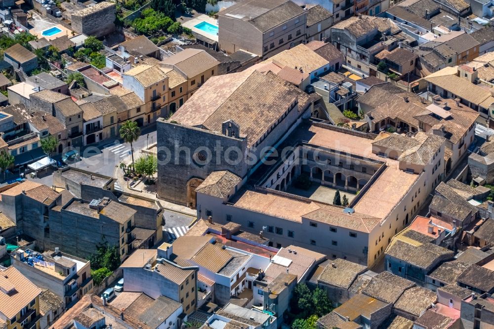 Aerial image Muro - Complex of buildings of the monastery Iglesia Y Claustro De Santa Ana on Placa del Convent in Muro in Balearic island of Mallorca, Spain