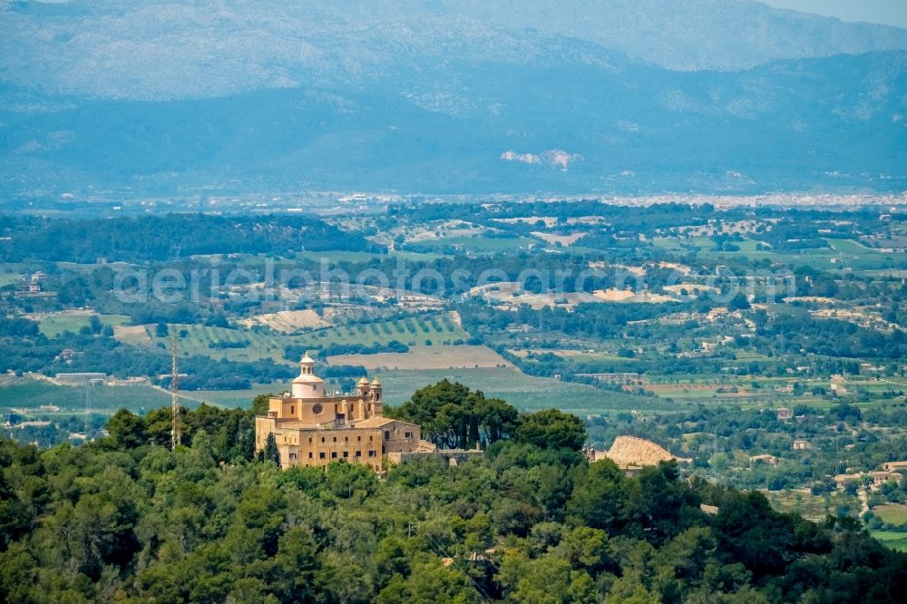 Aerial photograph Petra - Complex of buildings of the monastery Santuari de la Mare de Deu de Bonany with the shrine of the same name La Mare de Deu de Bonany in Petra in Balearic island of Mallorca, Spain