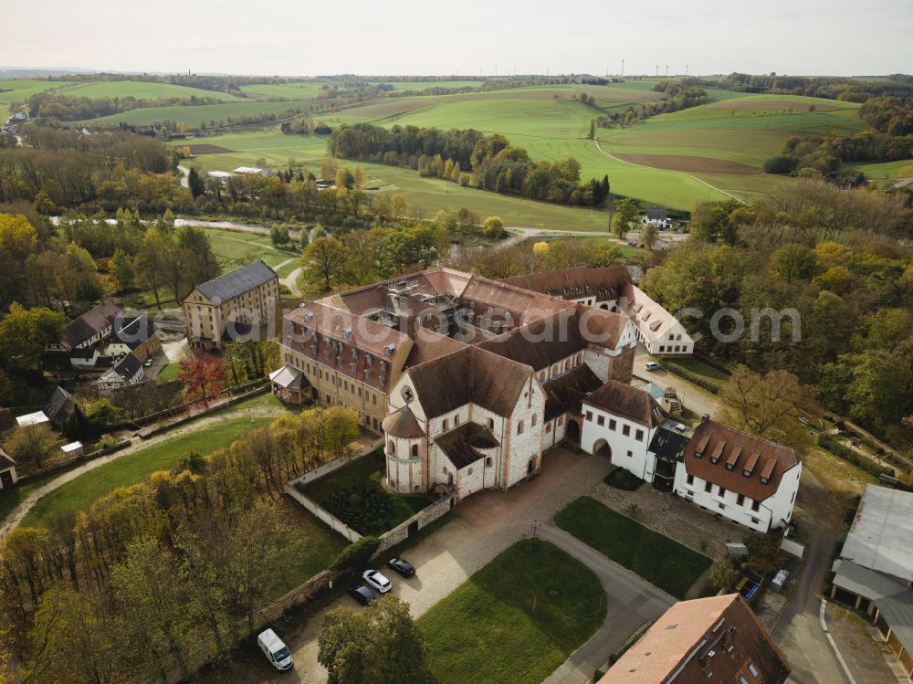 Aerial image Wechselburg - Complex of buildings of the monastery of Wechselburg in the state of Saxony. The benedictine compound includes a late-romanic Basilika. The church is parochial church and a place of pilgrimage