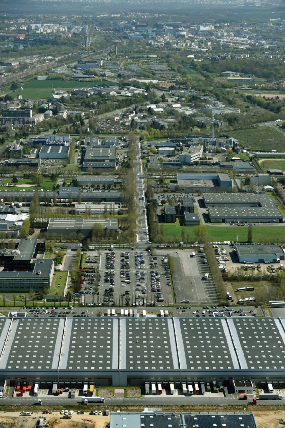 Trappes from the bird's eye view: Building complex and distribution center on the site Auchan on Rue Roger Hennequin in Trappes in Ile-de-France, France