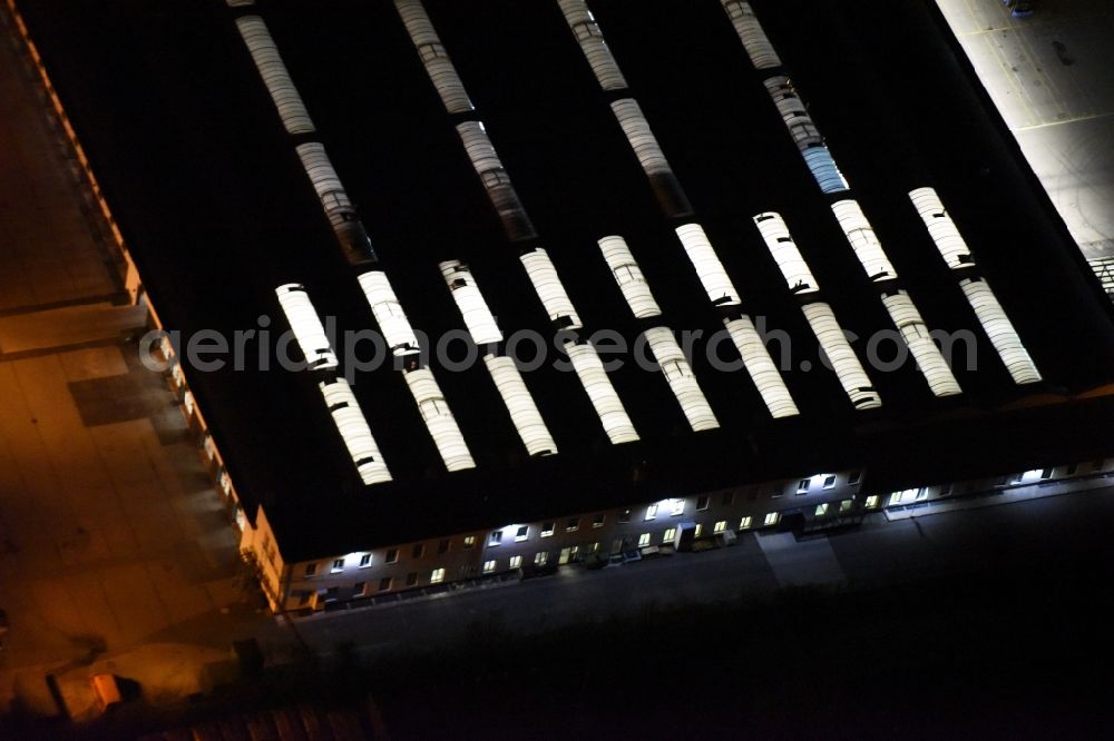 München from above - Night view Building complex and distribution center on the site Wertstoffhof in Muenchen Steinhausen an der Truderinger Strasse in Munich in the state Bavaria