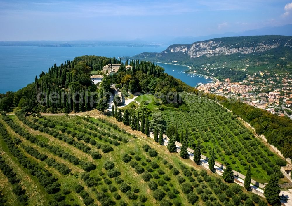 Bardolino from the bird's eye view: Complex of buildings of the monastery Eremo San Giorgio - saint George on top of the mountain Rocca di Garda in Veneto, Italy