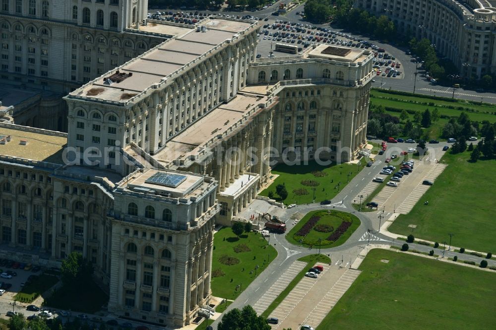 Aerial photograph Bukarest - View of the building Palace of the People in Bucharest, Romania. The magnificent building at the same time used as the parliamentary seat is built in real-socialist, Stalinist embossed power architecture and also houses the National Museum of Contemporary Art