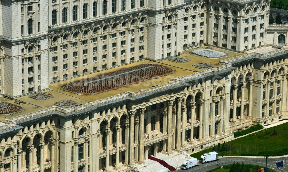 Aerial image Bukarest - View of the building Palace of the People in Bucharest, Romania. The magnificent building at the same time used as the parliamentary seat is built in real-socialist, Stalinist embossed power architecture and also houses the National Museum of Contemporary Art