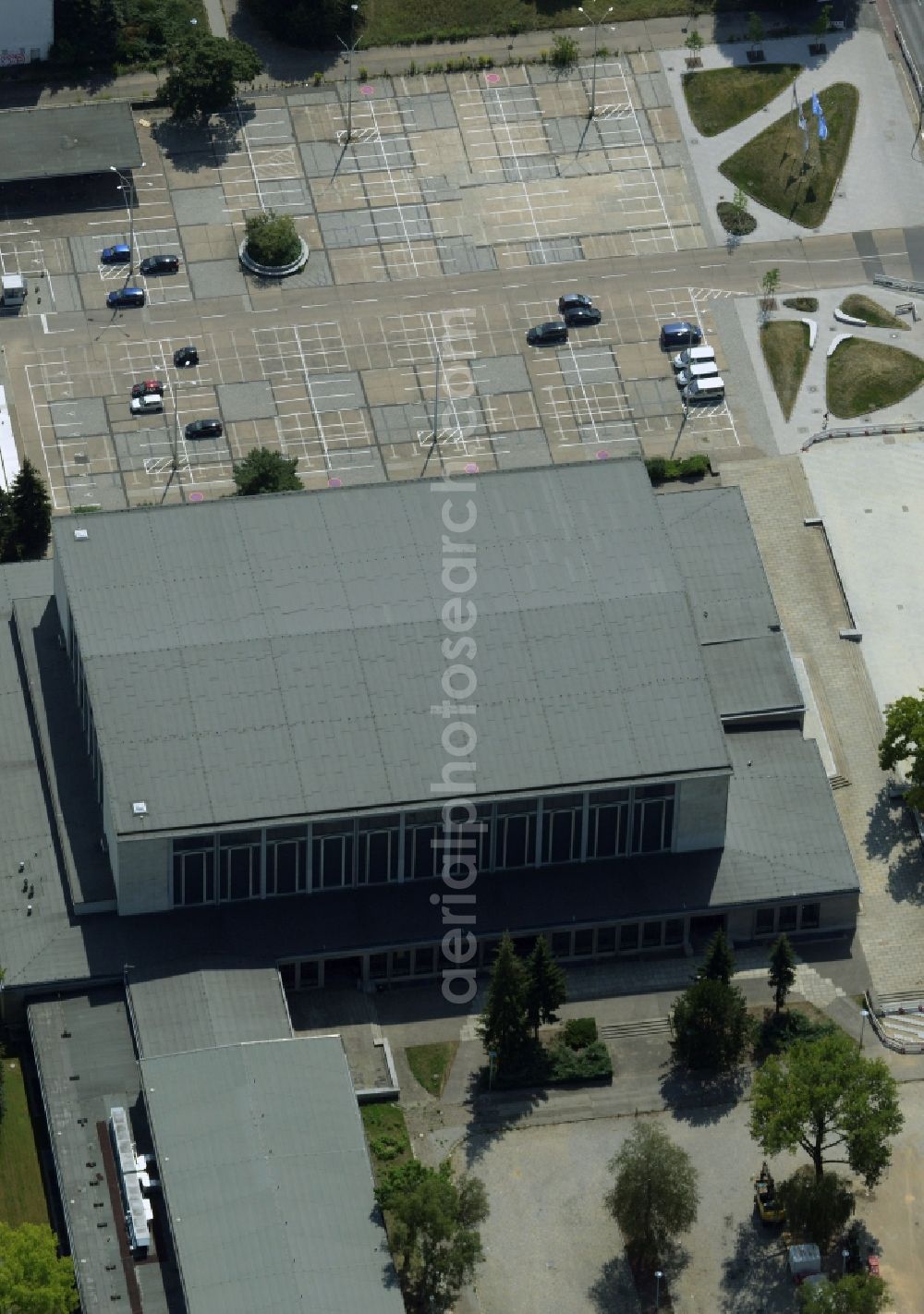 Berlin from the bird's eye view: Building complex and parking lot at the main entrance of the Sportforum Hohenschoenhausen in the Alt-Hohenschoenhausen part of the district of Lichtenberg in Berlin in Germany