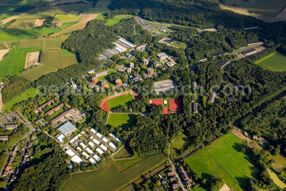 Selm from above - Building complex of the police in Selm in the state North Rhine-Westphalia. On the site of the car park a tent city has emerged as asylum reception centers and refugee accommodation