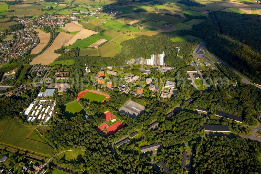 Aerial photograph Selm - Building complex of the police in Selm in the state North Rhine-Westphalia. On the site of the car park a tent city has emerged as asylum reception centers and refugee accommodation