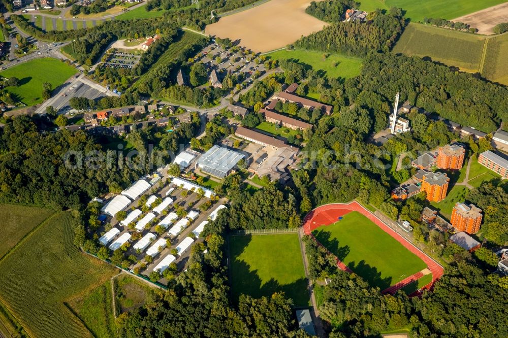 Selm from above - Building complex of the police in Selm in the state North Rhine-Westphalia. On the site of the car park a tent city has emerged as asylum reception centers and refugee accommodation