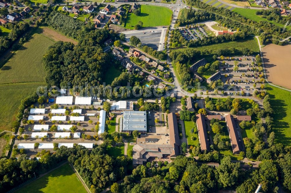 Selm from the bird's eye view: Building complex of the police in Selm in the state North Rhine-Westphalia. On the site of the car park a tent city has emerged as asylum reception centers and refugee accommodation