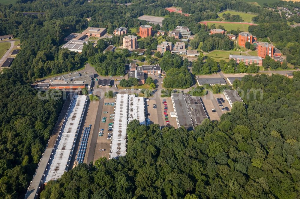 Selm from the bird's eye view: Building complex of the police in Selm in the state North Rhine-Westphalia. On the site of the car park a tent city has emerged as asylum reception centers and refugee accommodation