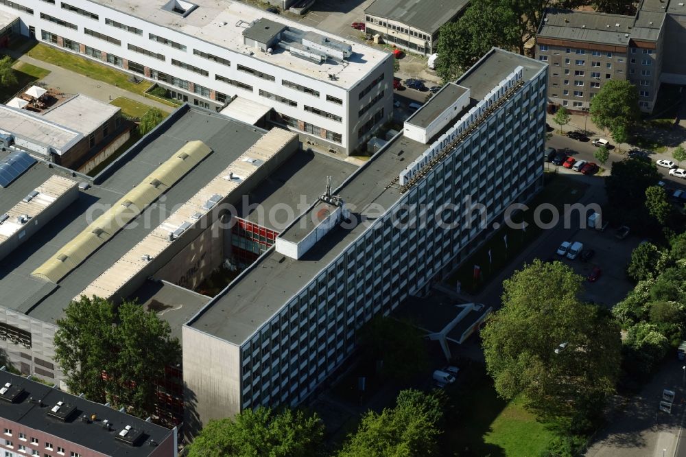 Aerial photograph Berlin - Publishing house complex of the press and media house Neues Deutschland at the Franz-Mehring-Platz in the district Friedrichshain in Berlin, Germany. The building also houses the Rosa Luxemburg Foundation - Society Analysis and Political Education e. V