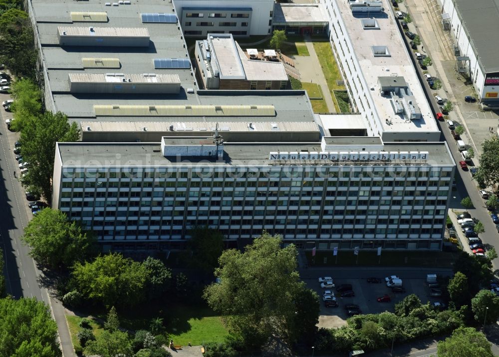 Berlin from the bird's eye view: Publishing house complex of the press and media house Neues Deutschland at the Franz-Mehring-Platz in the district Friedrichshain in Berlin, Germany. The building also houses the Rosa Luxemburg Foundation - Society Analysis and Political Education e. V