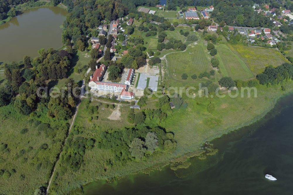 Werder (Havel) from the bird's eye view: Building complex in the park of Castle Petzow in Werder (Havel) in Brandenburg. The castle was built in 1825 to plans by Schinkel, the castle park was designed in 1838 by Peter Joseph Lenne