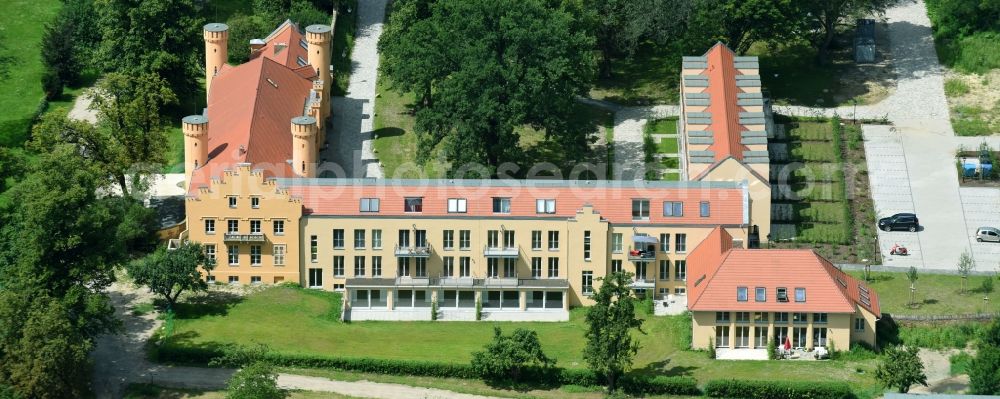 Werder (Havel) from the bird's eye view: Building complex in the park of Castle Petzow in Werder (Havel) in Brandenburg. The castle was built in 1825 to plans by Schinkel, the castle park was designed in 1838 by Peter Joseph Lenne