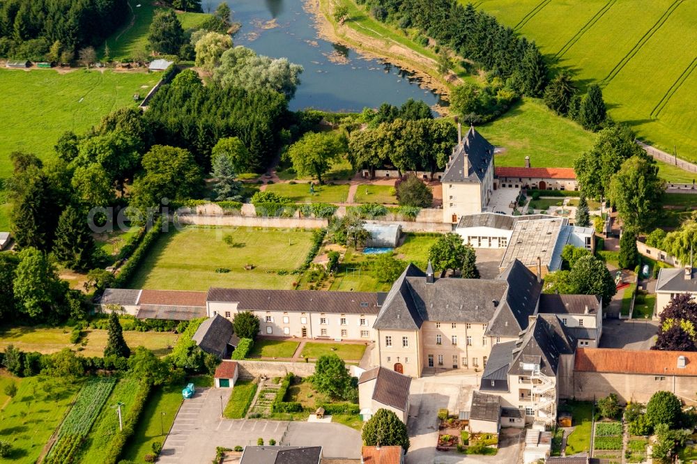 Rettel from above - Building complex in the park of the castle at shore of the Mosel river in Rettel in Grand Est, France