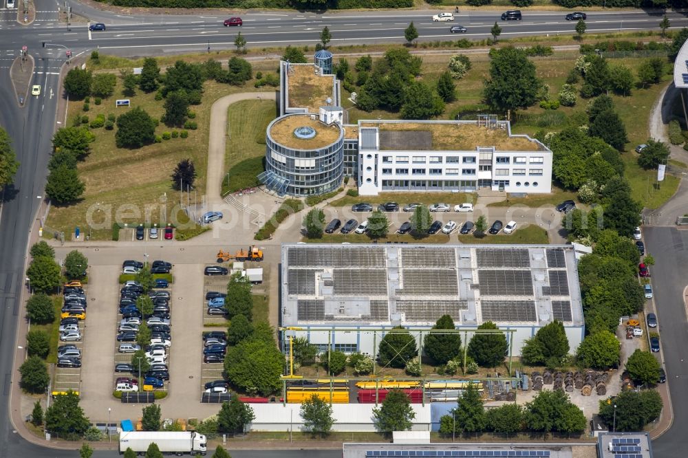 Unna from the bird's eye view: Building complex of the public services in the industrial area of Unna in the state of North Rhine-Westphalia. The compound includes a distinct round and rectangular building and a parking lot