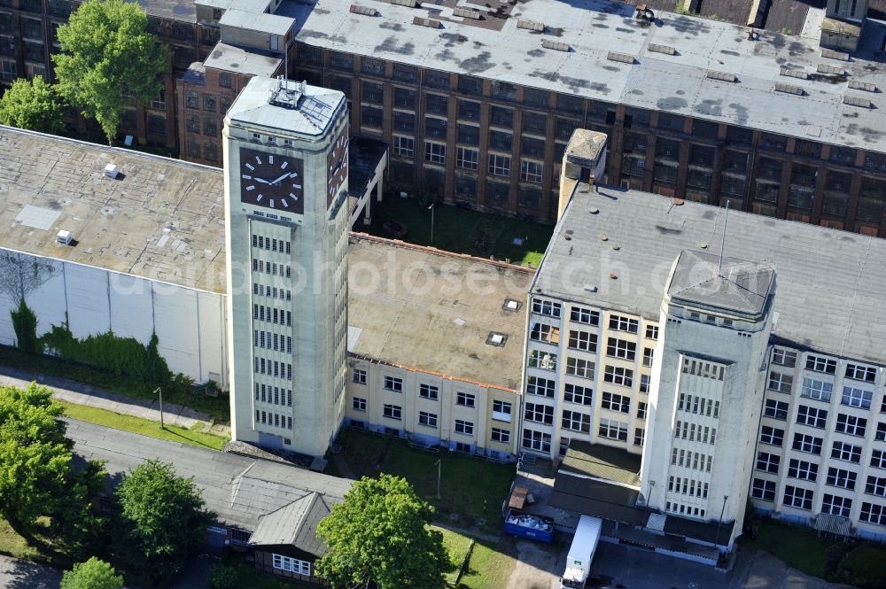 Wittenberge from the bird's eye view: View of the abandoned buildings of the former Veritas at the Bad Wilsnacker street in Wittenberg in the state of Brandenburg. After the dismantling of the singer-plant production under the name Veritas was continued. The clock tower of the former Singer sewing machine factory / Veritas in Wittenberg Germany is the largest and second largest clock tower in Europe