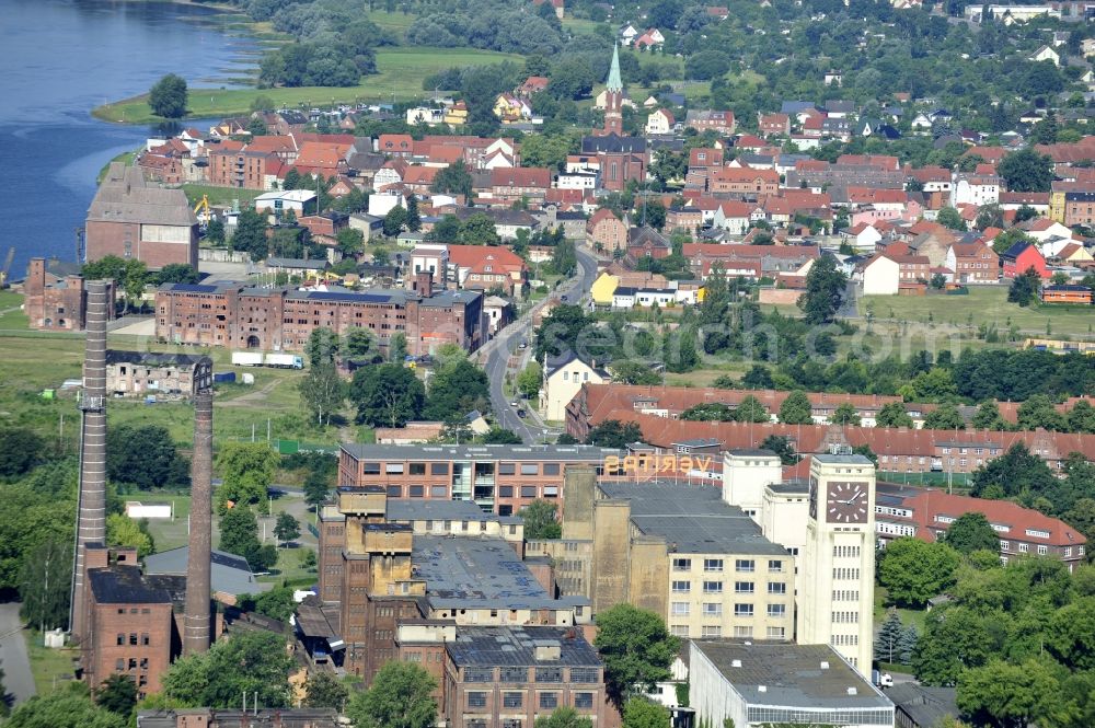 Aerial image Wittenberge - View of the abandoned buildings of the former Veritas at the Bad Wilsnacker street in Wittenberg in the state of Brandenburg. After the dismantling of the singer-plant production under the name Veritas was continued. The clock tower of the former Singer sewing machine factory / Veritas in Wittenberg Germany is the largest and second largest clock tower in Europe